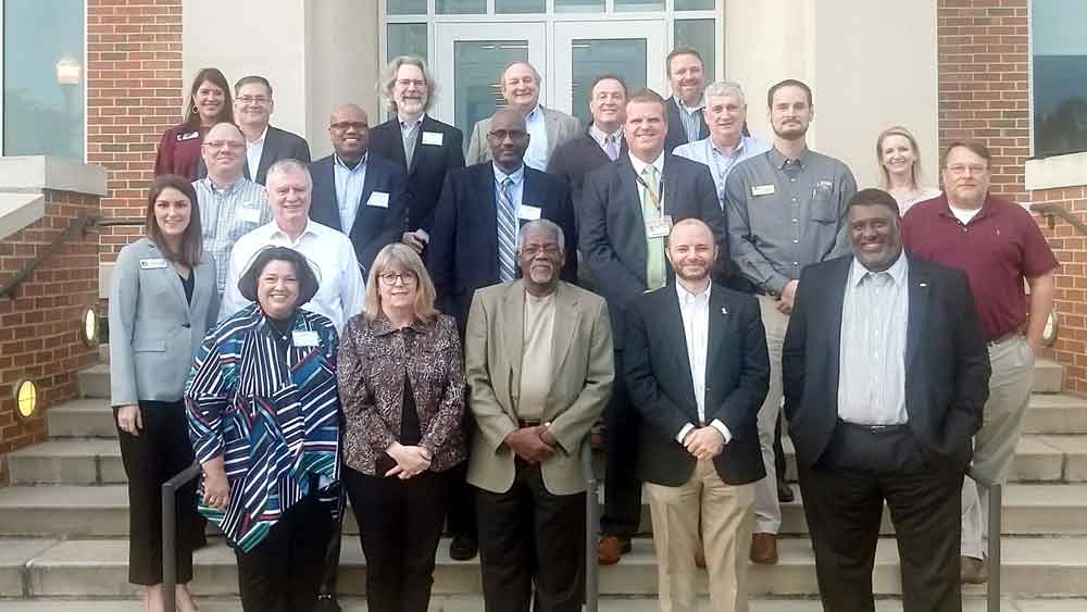 Members of the AL CIO Council standing in front of the Auburn OIT building.